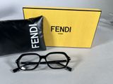 fendi eyeglasses in a box and a pair of glasses on a table