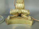 a gold lamp that is sitting on top of a table