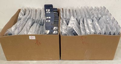 a lot of silverware in a box on a table