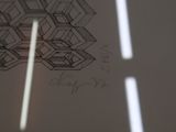 a drawing on the wall of a room with light coming through the window
