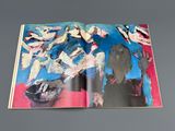 an open book with a picture of a group of people on it