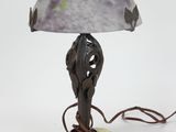 a lamp that has a glass shade on it