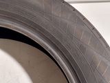 a close up of a tire on a white surface