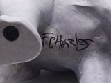 a white elephant that has writing on the side of it