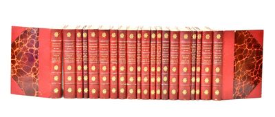 the twelve books are lined up in a row on a white surface