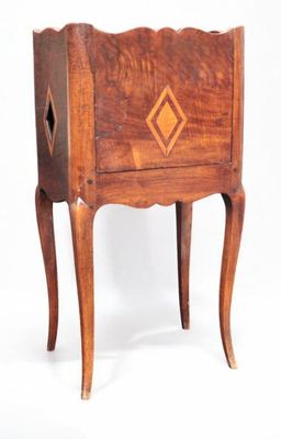 a small wooden table with a drawer on top of it