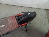 a scooter that is sitting on the floor in the room