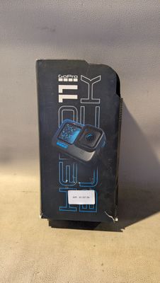 a box with a cell phone in it sitting on a table