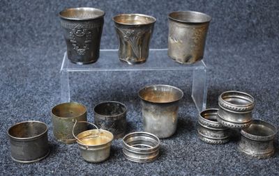 many cups that are sitting on a clear stand