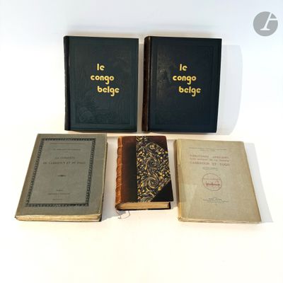 three books are sitting next to each other on a white surface