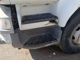 a close up of a truck ' s front end with the door open