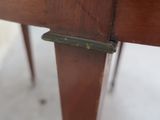 a close up of a wooden table with a metal latch on it