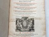 an open book with a picture of a coat of arms and a coat of arms on it