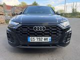 the front of a black audi suv parked in a parking lot