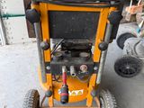 a small machine that is sitting in the garage