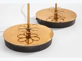 pair of brass plate lamps with black bases and a gold base