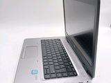 a laptop computer that is sitting on a white table