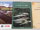 two books on a table with a river in the background