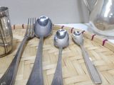 a tray with silverware and silverware on it