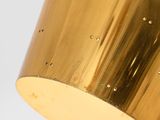 an image of a gold lamp hanging from the ceiling