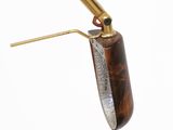 an image of a lighter with a brass handle and a wooden handle