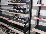 many shelves with various items in them in a store