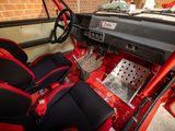 the interior of a car with red seats and a black dashboard