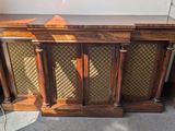 an old radio sitting on top of a wooden table