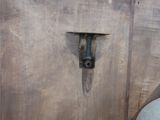 a wooden door with a metal latch on it