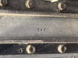 a close up of a metal object with screws on it