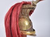 an image of a helmet with red hair on a white background