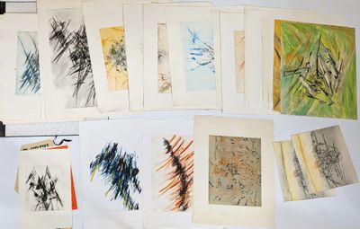 a lot of different colored drawings on a table