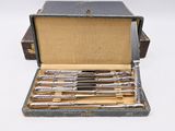 a box with a bunch of knives inside of it