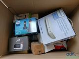 a cardboard box filled with electronic devices and other items