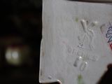 a close up of a white vase with writing on it