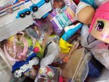 a pile of toys and toys in a plastic bag