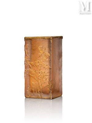 an image of a gold vase on a white surface