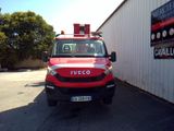 a red truck that is parked in front of a building