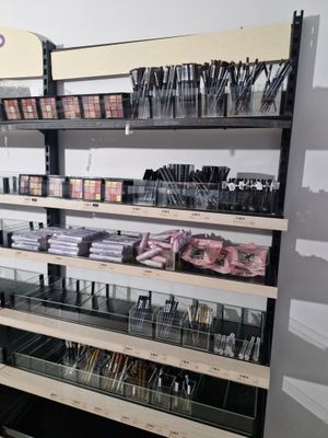 a large display of makeup products in a store