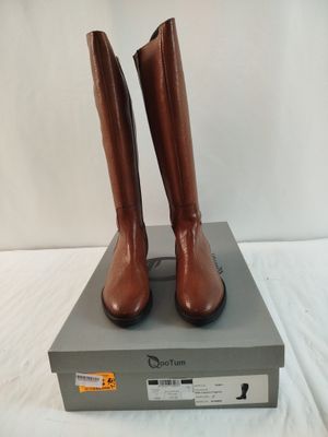 brown leather boots on a box on a white surface
