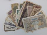 a pile of old money sitting on a table