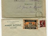 two old envelopes with stamps are sitting on top of each other