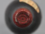 underside view of a bottle of wine with a label on it