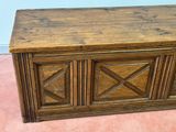 a wooden chest sitting on the floor in a room