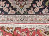 a close up view of a rug with a cat on it
