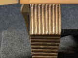 a close up of a wooden cabinet with a door open