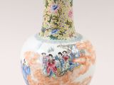 a vase that has a picture of people on it