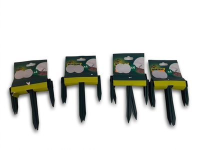 four black and yellow plastic forks are lined up against a white background
