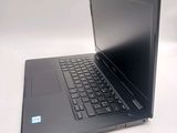 a laptop that is sitting on a white table