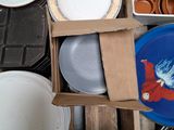 a box full of plates and bowls sitting on a table